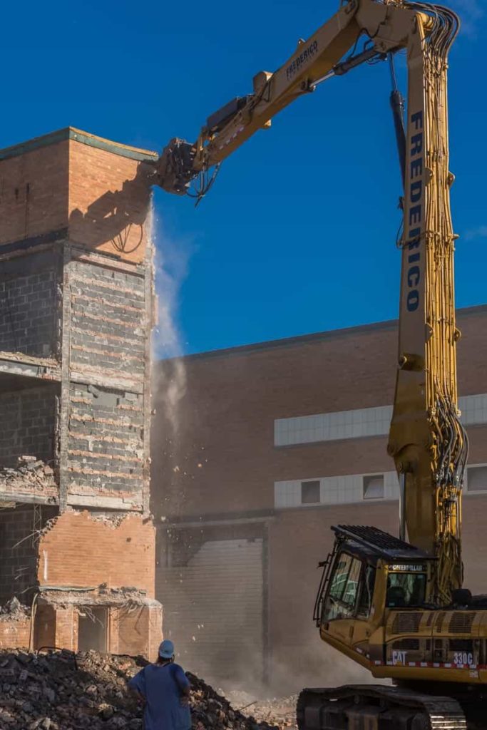 crane demolishing building